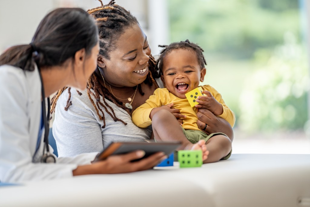 Family at a pediatrician's office for a routine check-up